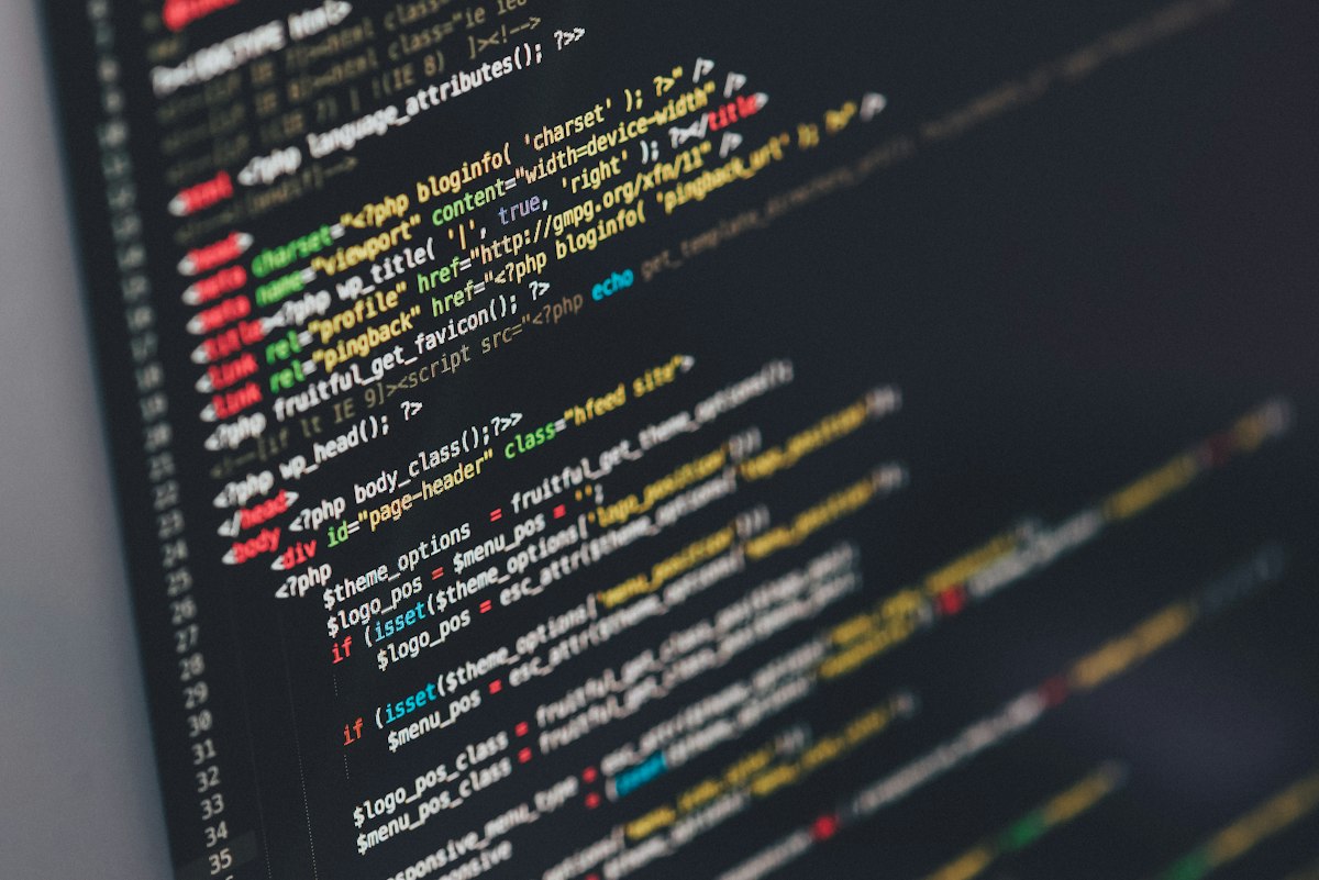 Developer writing code on screen